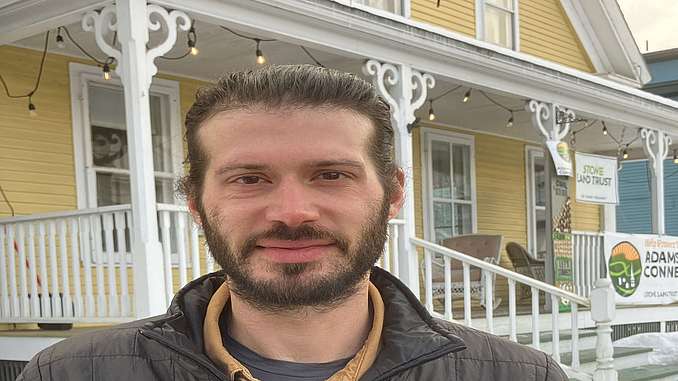 Photo of Alex Kauffman smiling in front of the Stowe Land Trust office. Photo links to Alex’s staff bio.